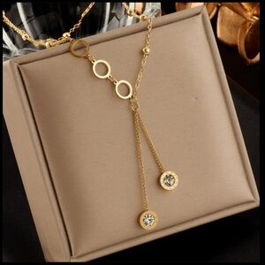 Golden necklace with zircon stones